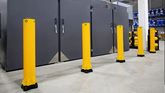Warehouse safety systems including barriers and bollards